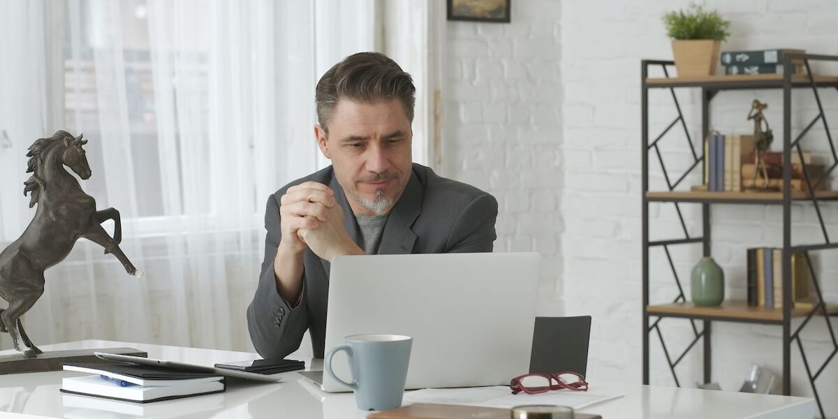 Untitled design – 1 Mature man working on computer