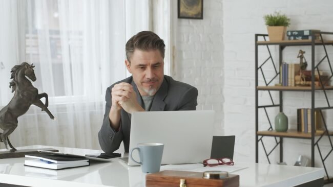 Mature man working on computer